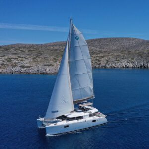luxury catamaran sailing in Crete with turquoise sea and coastline